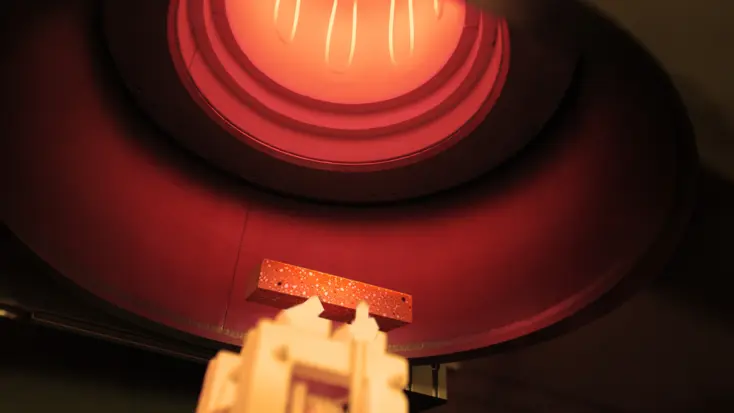 RFDA specimen glowing inside an IMCE high-temperature furnace
