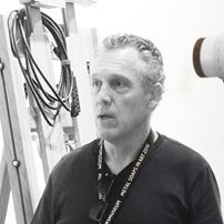 Properly conserving art for Dale Kronkright (right) means protecting art from vibrational stress during transportation. Here he is using a Polytec MPV-800 Multipoint Vibrometer system to analyze the vibrational characteristics of a painted canvas.